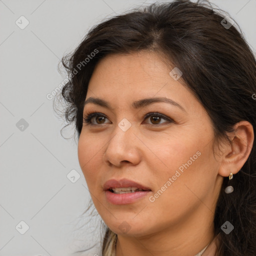 Joyful white adult female with long  brown hair and brown eyes