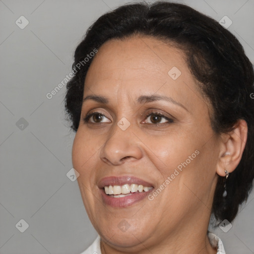 Joyful black adult female with medium  brown hair and brown eyes