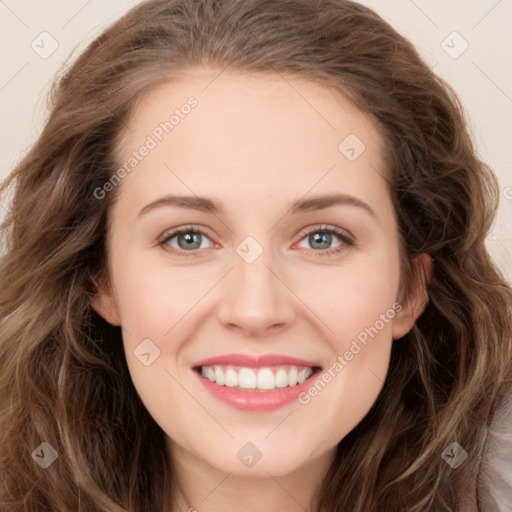 Joyful white young-adult female with long  brown hair and green eyes