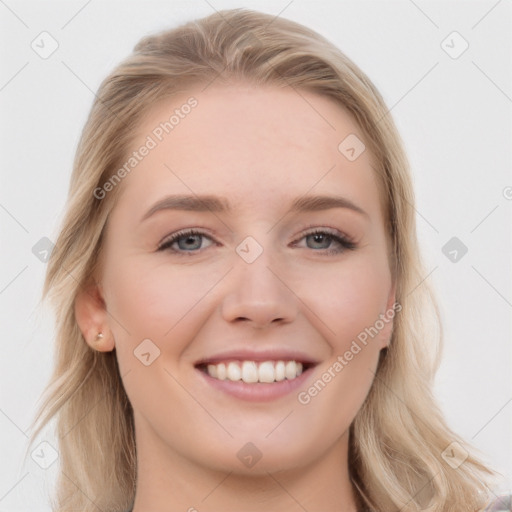 Joyful white young-adult female with long  brown hair and blue eyes