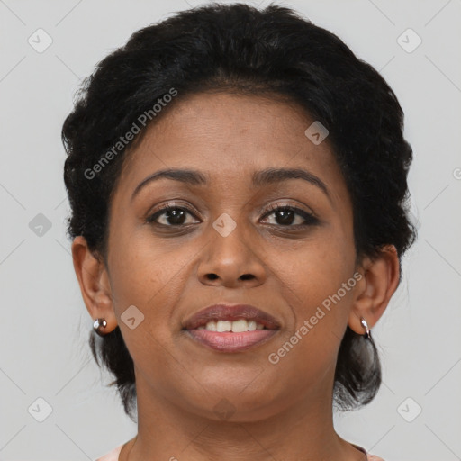 Joyful black young-adult female with short  brown hair and brown eyes