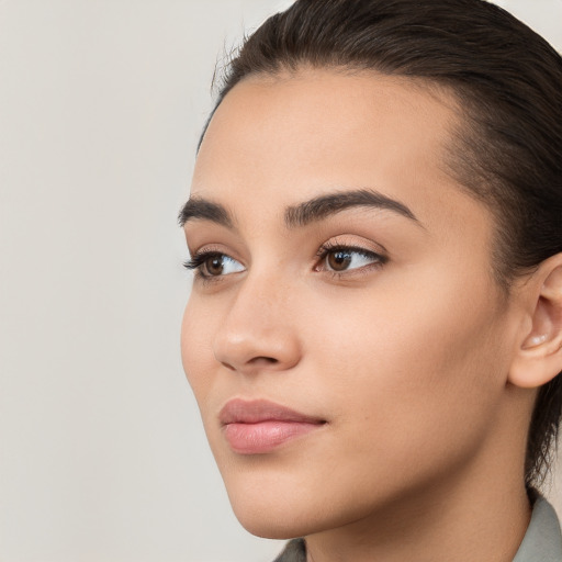 Neutral white young-adult female with medium  brown hair and brown eyes