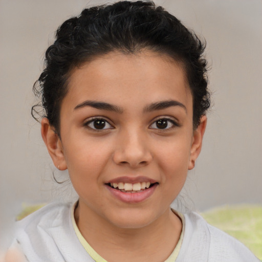 Joyful latino child female with short  brown hair and brown eyes