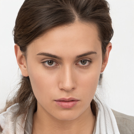 Neutral white young-adult female with medium  brown hair and brown eyes