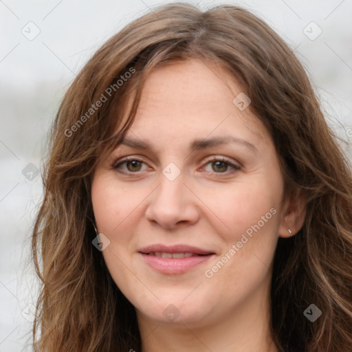 Joyful white young-adult female with long  brown hair and green eyes