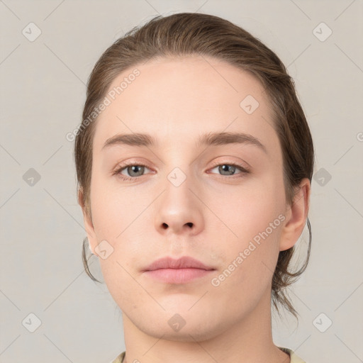 Neutral white young-adult female with medium  brown hair and grey eyes