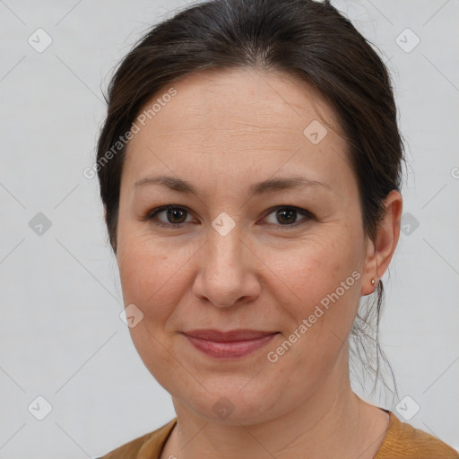 Joyful white adult female with short  brown hair and brown eyes