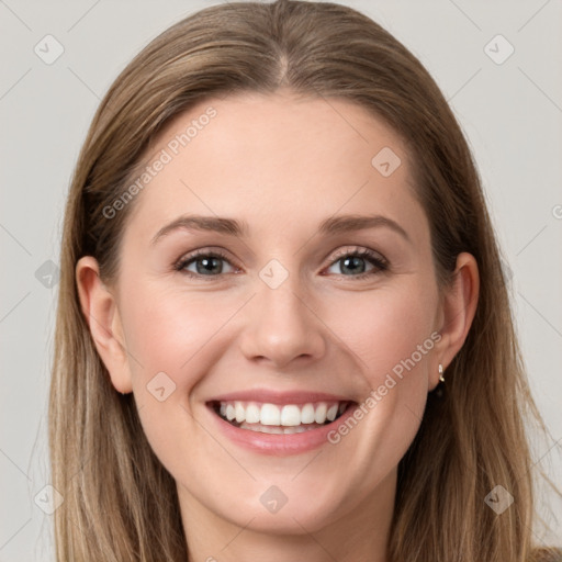 Joyful white young-adult female with long  brown hair and grey eyes