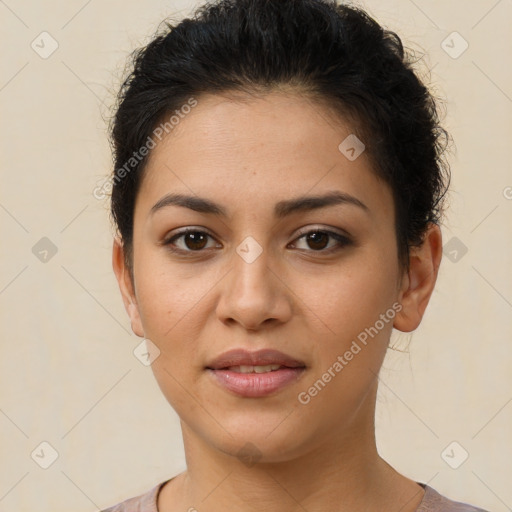 Joyful latino young-adult female with short  brown hair and brown eyes