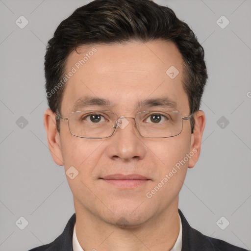 Joyful white adult male with short  black hair and brown eyes