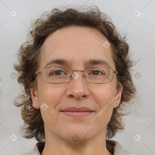 Joyful white adult female with medium  brown hair and blue eyes