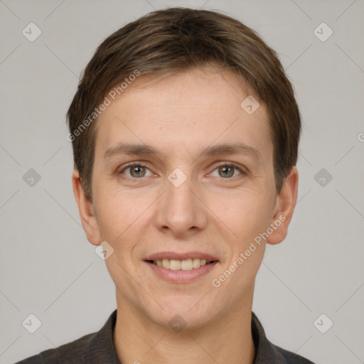 Joyful white adult female with short  brown hair and grey eyes