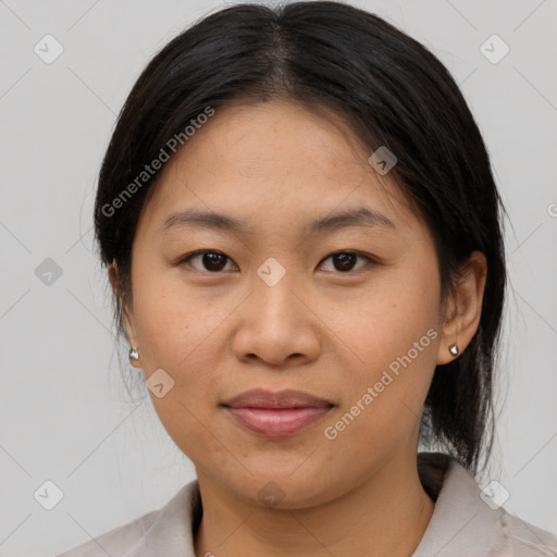 Joyful asian young-adult female with medium  brown hair and brown eyes