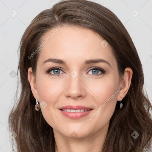 Joyful white young-adult female with long  brown hair and grey eyes