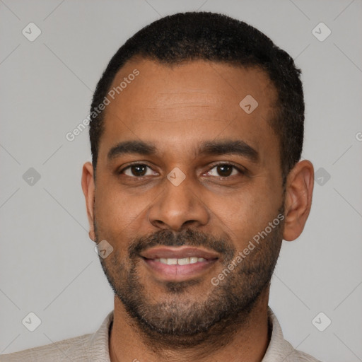 Joyful latino young-adult male with short  black hair and brown eyes