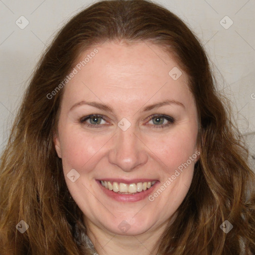 Joyful white adult female with long  brown hair and brown eyes