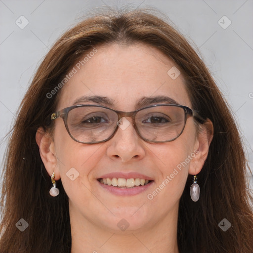 Joyful white adult female with long  brown hair and brown eyes