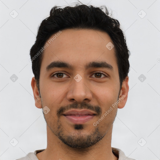 Joyful latino young-adult male with short  black hair and brown eyes