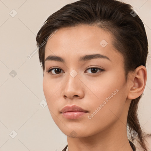 Neutral white young-adult female with long  brown hair and brown eyes