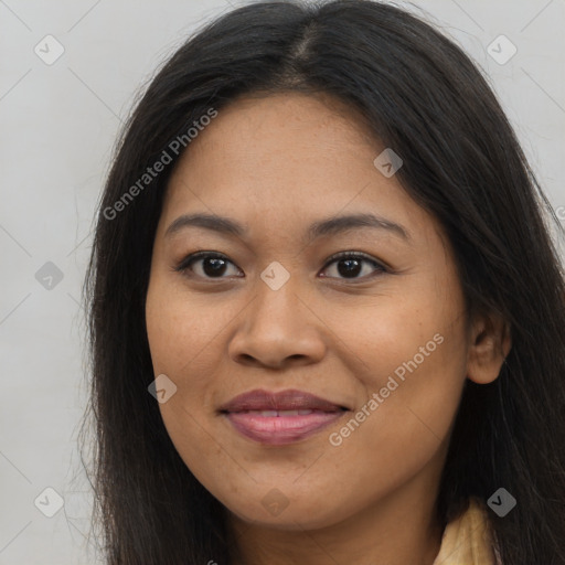 Joyful asian young-adult female with long  brown hair and brown eyes