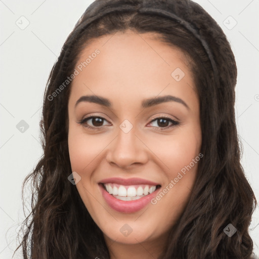 Joyful white young-adult female with long  black hair and brown eyes