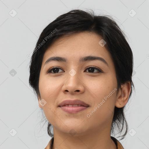 Joyful asian young-adult female with medium  black hair and brown eyes