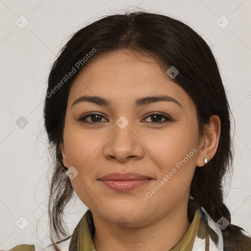 Joyful latino young-adult female with medium  brown hair and brown eyes