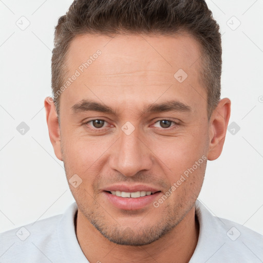 Joyful white young-adult male with short  brown hair and brown eyes