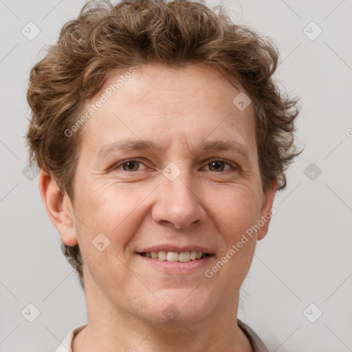 Joyful white adult female with short  brown hair and grey eyes