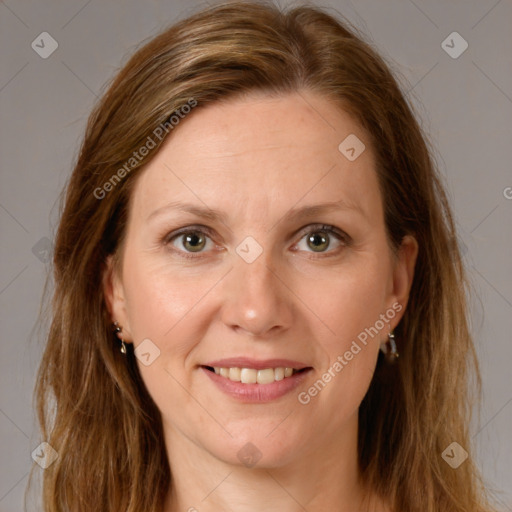 Joyful white adult female with long  brown hair and brown eyes