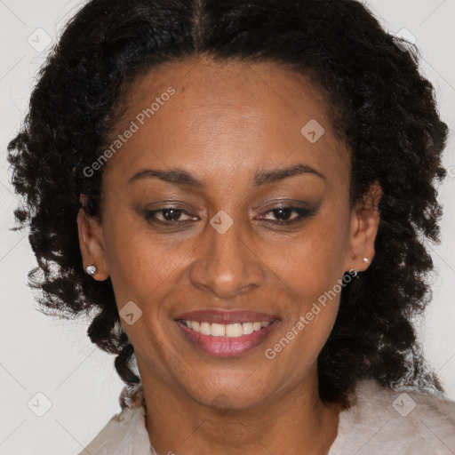 Joyful latino adult female with medium  brown hair and brown eyes