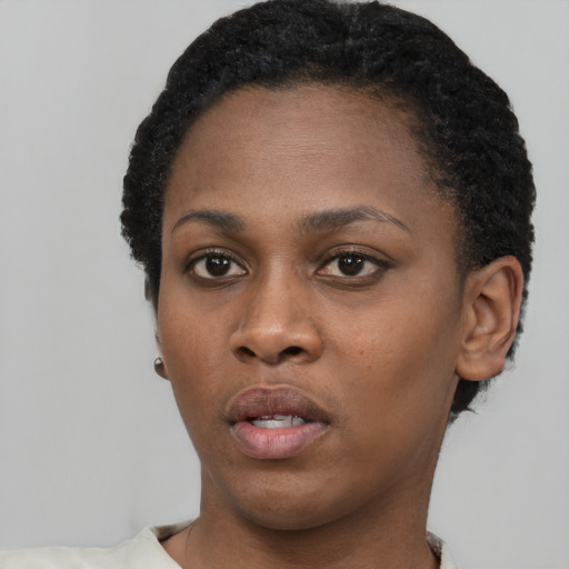 Neutral black young-adult female with short  black hair and brown eyes
