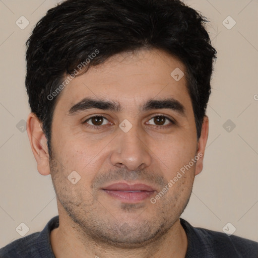 Joyful white young-adult male with short  black hair and brown eyes