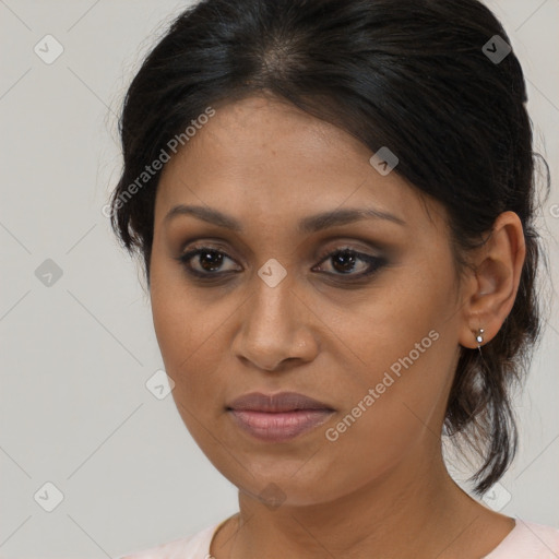 Joyful black young-adult female with medium  brown hair and brown eyes