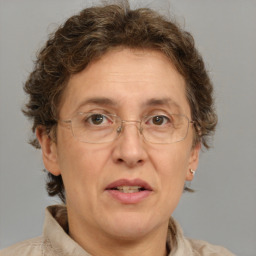 Joyful white middle-aged female with short  brown hair and brown eyes