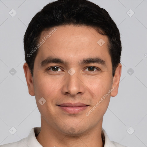 Joyful white young-adult male with short  black hair and brown eyes