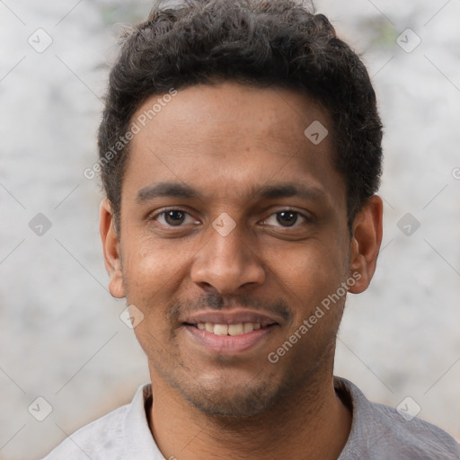 Joyful black young-adult male with short  brown hair and brown eyes