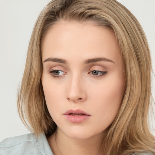 Neutral white young-adult female with long  brown hair and brown eyes