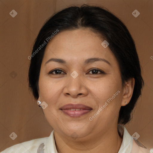 Joyful latino adult female with medium  brown hair and brown eyes