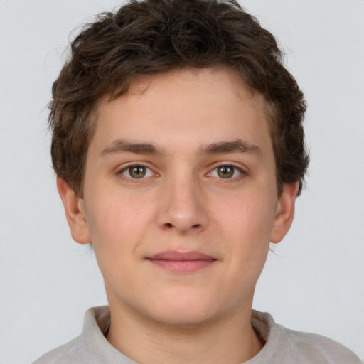 Joyful white child male with short  brown hair and brown eyes