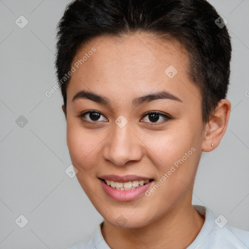 Joyful white young-adult female with short  brown hair and brown eyes