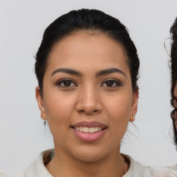 Joyful latino young-adult female with short  brown hair and brown eyes