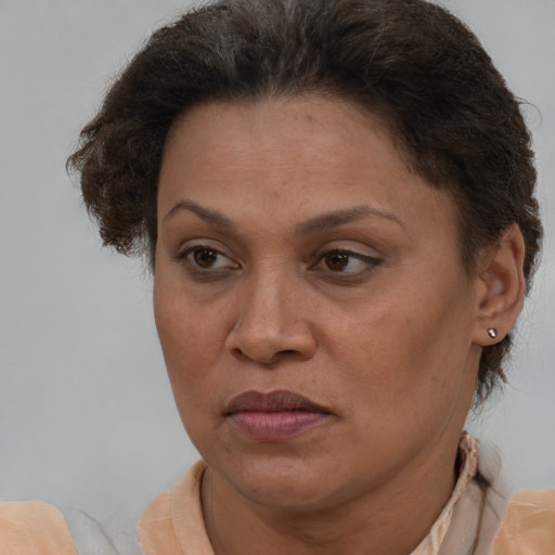 Joyful white adult female with short  brown hair and brown eyes