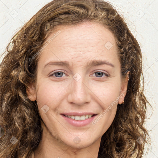 Joyful white young-adult female with long  brown hair and green eyes