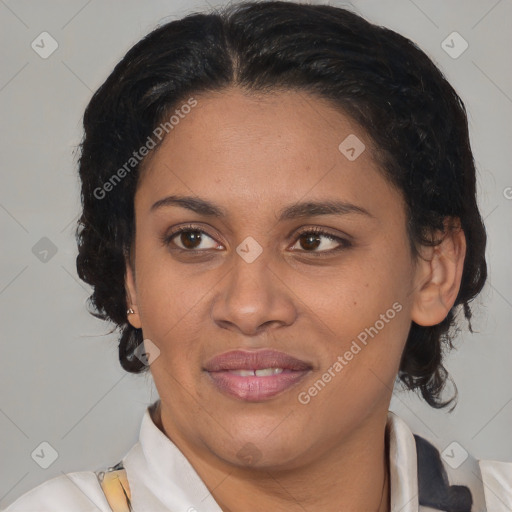 Joyful latino adult female with medium  brown hair and brown eyes