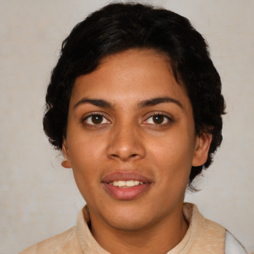 Joyful latino young-adult female with short  black hair and brown eyes
