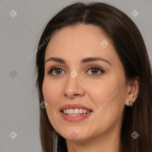 Joyful white young-adult female with long  brown hair and brown eyes