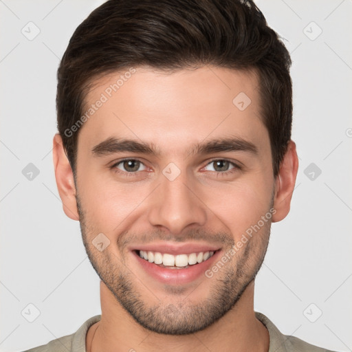 Joyful white young-adult male with short  brown hair and brown eyes