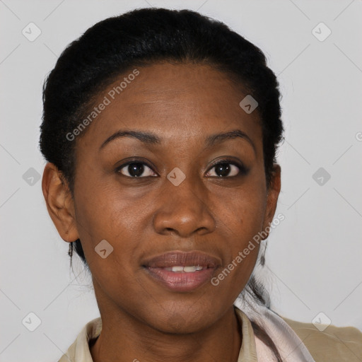 Joyful black adult female with short  brown hair and brown eyes