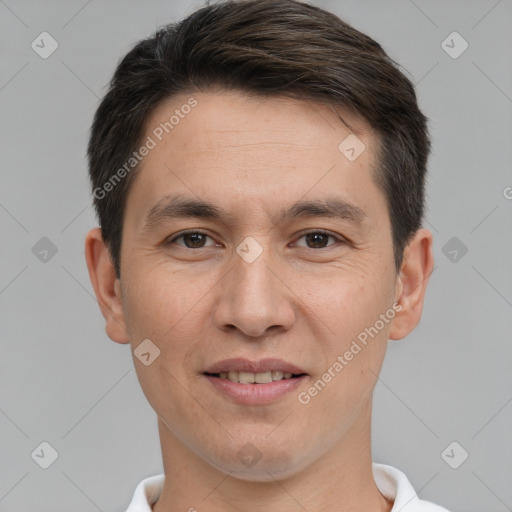 Joyful white adult male with short  brown hair and brown eyes